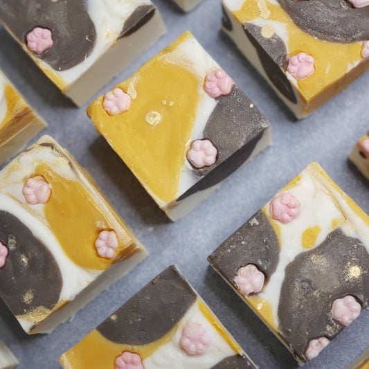 calico cat patterned bars of soap with mini pink paw prints on top