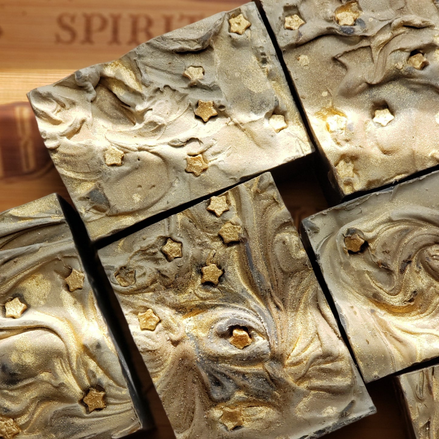 grey soap bars with gold swirls and gold stars