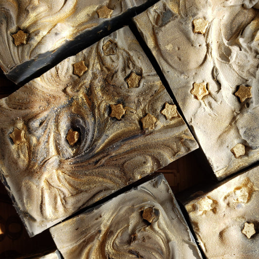 grey soap bars with gold swirls and gold stars