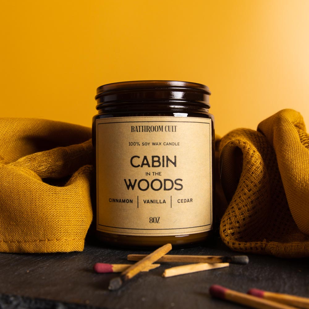 amber glass candle reading cabin in the woods: cinnamon, vanilla, cedar